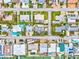 Aerial view showcasing the coastal neighborhood with various homes, green spaces, and street layout at 256 144Th Ave, Madeira Beach, FL 33708
