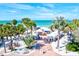 Beautiful aerial view of a community market near the beach with lots of shoppers and palm trees at 256 144Th Ave, Madeira Beach, FL 33708