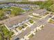 A planned community featuring townhomes, mature trees and landscaping, and manicured lawns at 2718 Chestnut Creek Pl, Brandon, FL 33510