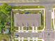 Aerial view of townhomes with private driveways and well-manicured lawns in a quiet neighborhood at 2718 Chestnut Creek Pl, Brandon, FL 33510