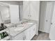 Bathroom featuring double sinks with granite countertops and modern fixtures at 2718 Chestnut Creek Pl, Brandon, FL 33510