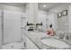 Bright bathroom with a double granite vanity and shower at 2718 Chestnut Creek Pl, Brandon, FL 33510