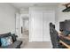 Bedroom featuring plush gray sofa and a closet at 2718 Chestnut Creek Pl, Brandon, FL 33510