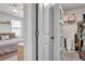 Walk-in closet with shelving and rod, connected to bedroom with ceiling fan and natural light at 2718 Chestnut Creek Pl, Brandon, FL 33510
