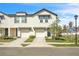 Charming townhome featuring an attached garage, neutral paint, and neatly landscaped front yard at 2718 Chestnut Creek Pl, Brandon, FL 33510