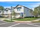 Street corner view of townhouse complex with well-maintained landscaping at 2718 Chestnut Creek Pl, Brandon, FL 33510