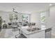 Open-concept kitchen and living area boasting granite countertops, stainless steel appliances and natural light at 2718 Chestnut Creek Pl, Brandon, FL 33510