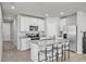 Kitchen featuring a large granite island with counter seating and stainless steel appliances at 2718 Chestnut Creek Pl, Brandon, FL 33510