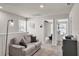 Upstairs landing offers a cozy sitting area and access to bedrooms at 2718 Chestnut Creek Pl, Brandon, FL 33510