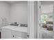 Laundry room with washer and dryer units and view to bedroom at 2718 Chestnut Creek Pl, Brandon, FL 33510