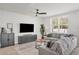 Bright living room features neutral décor, comfortable seating and large windows at 2718 Chestnut Creek Pl, Brandon, FL 33510