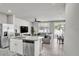 Open floor plan with a kitchen island, living area, and dining space at 2718 Chestnut Creek Pl, Brandon, FL 33510
