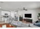 Open-concept living space with updated kitchen, seating at the island, and comfortable living area at 2718 Chestnut Creek Pl, Brandon, FL 33510