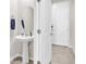 Bright powder room with a modern pedestal sink and round mirror at 2718 Chestnut Creek Pl, Brandon, FL 33510
