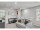 Upstairs sitting area near staircase features stylish decor and natural light at 2718 Chestnut Creek Pl, Brandon, FL 33510
