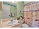 Charming bathroom with beach-themed shower curtain and a single sink vanity at 2808 60Th W Ave # 1722, Bradenton, FL 34207