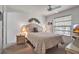 Bedroom featuring a bed, ceiling fan, a window with blinds, and a desk at 2808 60Th W Ave # 1722, Bradenton, FL 34207
