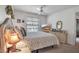 Bedroom featuring a bed, ceiling fan, a window with blinds, and a dresser with a TV at 2808 60Th W Ave # 1722, Bradenton, FL 34207