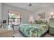 Bright bedroom featuring a floral-themed bed, desk near window, and light walls at 2808 60Th W Ave # 1722, Bradenton, FL 34207