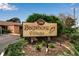 Attractive wooden community sign featuring a seashell for Bayshore Village surrounded by landscaped shrubs at 2808 60Th W Ave # 1722, Bradenton, FL 34207