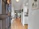 Inviting entryway that flows into a naturally lit open-concept living space with updated hardwood floors at 2808 60Th W Ave # 1722, Bradenton, FL 34207