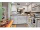 White kitchen featuring stainless steel appliances and ample counter space at 2808 60Th W Ave # 1722, Bradenton, FL 34207