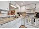 Bright kitchen featuring white cabinetry and countertops with stainless steel sink at 2808 60Th W Ave # 1722, Bradenton, FL 34207