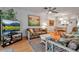 Comfortable living room with wicker furniture and a view of the dining area at 2808 60Th W Ave # 1722, Bradenton, FL 34207