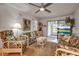 Inviting living room features wicker furniture, ceiling fan, and natural light at 2808 60Th W Ave # 1722, Bradenton, FL 34207