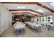 Large recreation room features high ceilings, tables and chairs, a brick fireplace, and a cozy seating area at 2808 60Th W Ave # 1722, Bradenton, FL 34207
