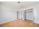 Bedroom featuring wood-look floors, a ceiling fan, and a large closet at 3011 Bougainvillea St, Sarasota, FL 34239