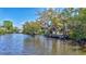 Scenic view of a private wooden dock on calm waters, perfect for relaxing or water activities at 3107 Pine St, Bradenton, FL 34208