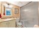 Well-lit bathroom with a shower, vanity, and accessible toilet features for added convenience at 3525 Lake Bayshore Dr # 103J, Bradenton, FL 34205
