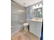 Clean bathroom with a glass-enclosed shower, white vanity, and soft blue walls for a refreshing feel at 3525 Lake Bayshore Dr # 103J, Bradenton, FL 34205