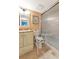 Well-lit bathroom with a shower, vanity, and accessible toilet features for added convenience at 3525 Lake Bayshore Dr # 103J, Bradenton, FL 34205