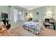 Cozy bedroom with a comfortable bed, soft lighting and decorative accents at 3525 Lake Bayshore Dr # 103J, Bradenton, FL 34205