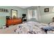Cozy bedroom with a large dresser, and a plush quilt at 3525 Lake Bayshore Dr # 103J, Bradenton, FL 34205