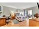 Comfortable bedroom with wood floors, and a sliding glass door to an outdoor patio at 3525 Lake Bayshore Dr # 103J, Bradenton, FL 34205