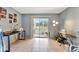 Bright bedroom featuring a sliding glass door and neutral paint tones at 3525 Lake Bayshore Dr # 103J, Bradenton, FL 34205