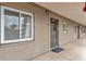 A ground-level condo's exterior shows a quaint entrance, natural light and easy access at 3525 Lake Bayshore Dr # 103J, Bradenton, FL 34205