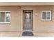 Exterior of condo featuring front door with security screen and decorative glass at 3525 Lake Bayshore Dr # 103J, Bradenton, FL 34205