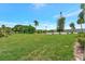 Expansive green grounds with mature trees offer picturesque views and community amenities near the lake at 3525 Lake Bayshore Dr # 103J, Bradenton, FL 34205