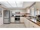 Well-lit kitchen featuring stainless steel appliances and ample counter space at 3525 Lake Bayshore Dr # 103J, Bradenton, FL 34205