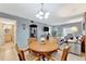 Open-concept living room and dining area with neutral paint tones and comfortable furniture at 3525 Lake Bayshore Dr # 103J, Bradenton, FL 34205