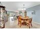 Open-concept living room and dining area filled with natural light and neutral paint tones at 3525 Lake Bayshore Dr # 103J, Bradenton, FL 34205