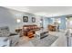 Inviting living room boasts a comfortable seating area and a seamless flow to the dining space at 3525 Lake Bayshore Dr # 103J, Bradenton, FL 34205