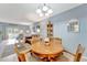 Inviting open-concept living room and dining area with comfortable furniture and tile floors at 3525 Lake Bayshore Dr # 103J, Bradenton, FL 34205