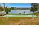 Scenic shuffleboard court by the lake offers relaxing recreation in a tranquil community setting at 3525 Lake Bayshore Dr # 103J, Bradenton, FL 34205