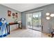 Versatile room with sliding glass doors leading to a sunroom and backyard views at 3525 Lake Bayshore Dr # 103J, Bradenton, FL 34205