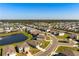 Aerial view showcasing home surrounded by pond and planned community at 3677 Turning Tides Ter, Bradenton, FL 34208